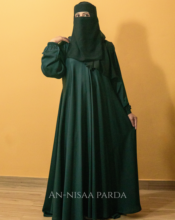 Model standing wearing a full-length plain casual gown with a flowing silhouette.