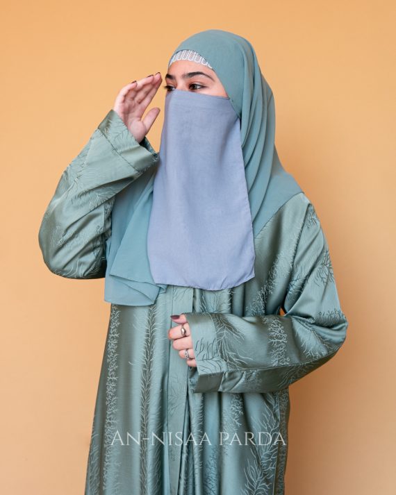 Closeup of model wearing Textured Jacquard Open-Front Gown showing texture and design
