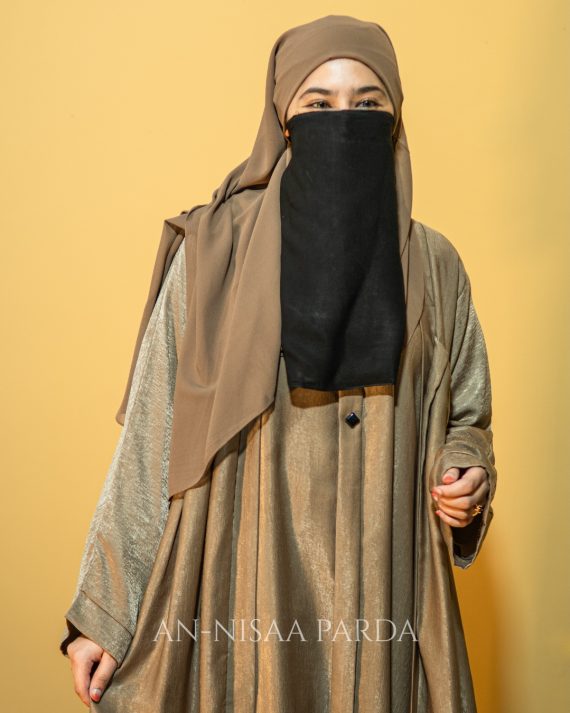 Close-up of faux double layer gown showing cape detail and fabric texture